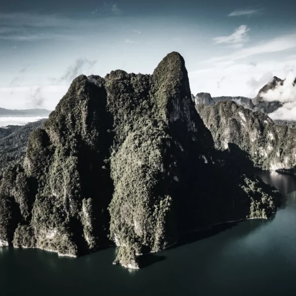 Karst mountains meet with jade lake at Khao Sok National park where locals actually go