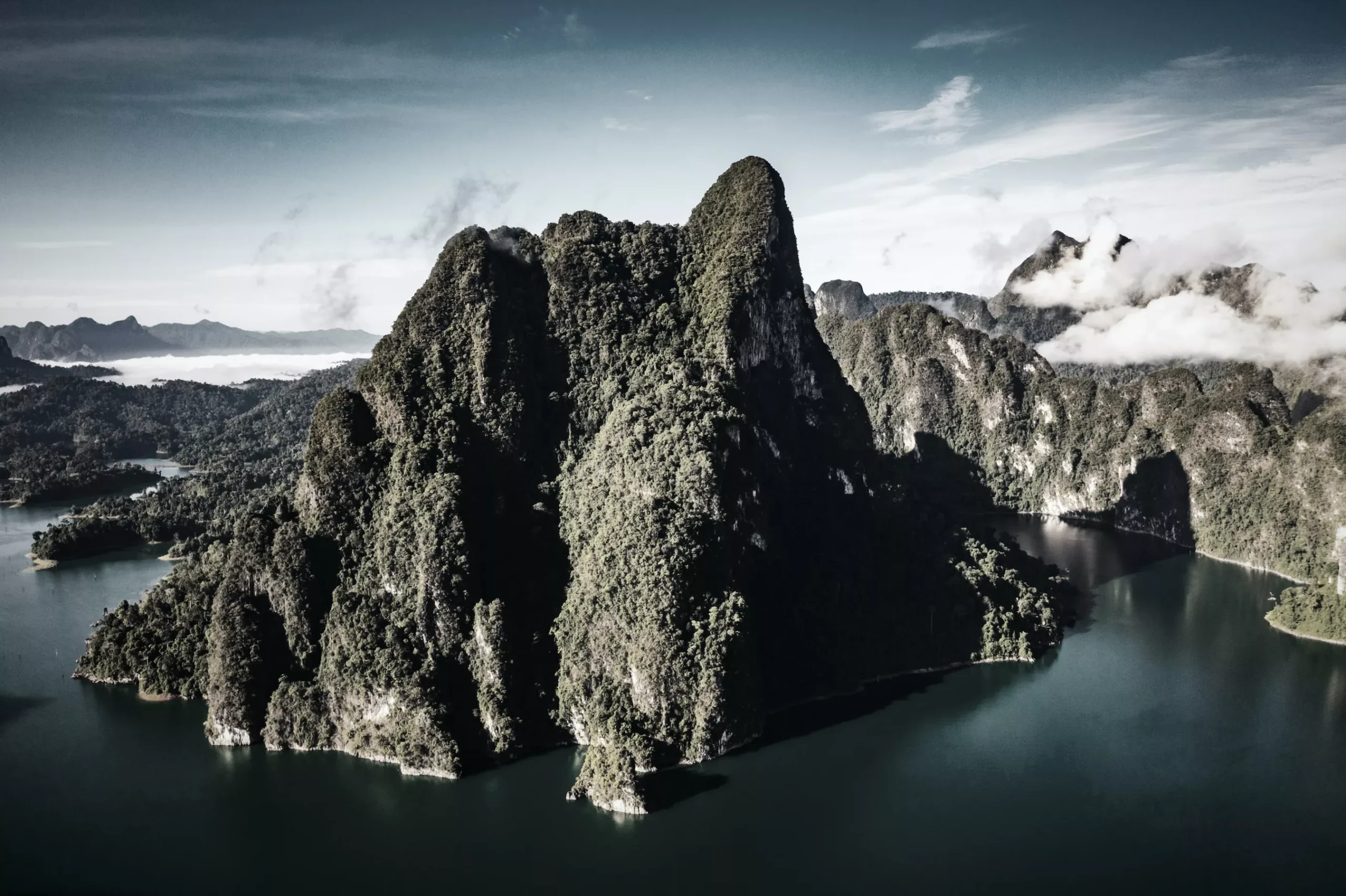 Karst mountains meet with jade lake at Khao Sok National park where locals actually go