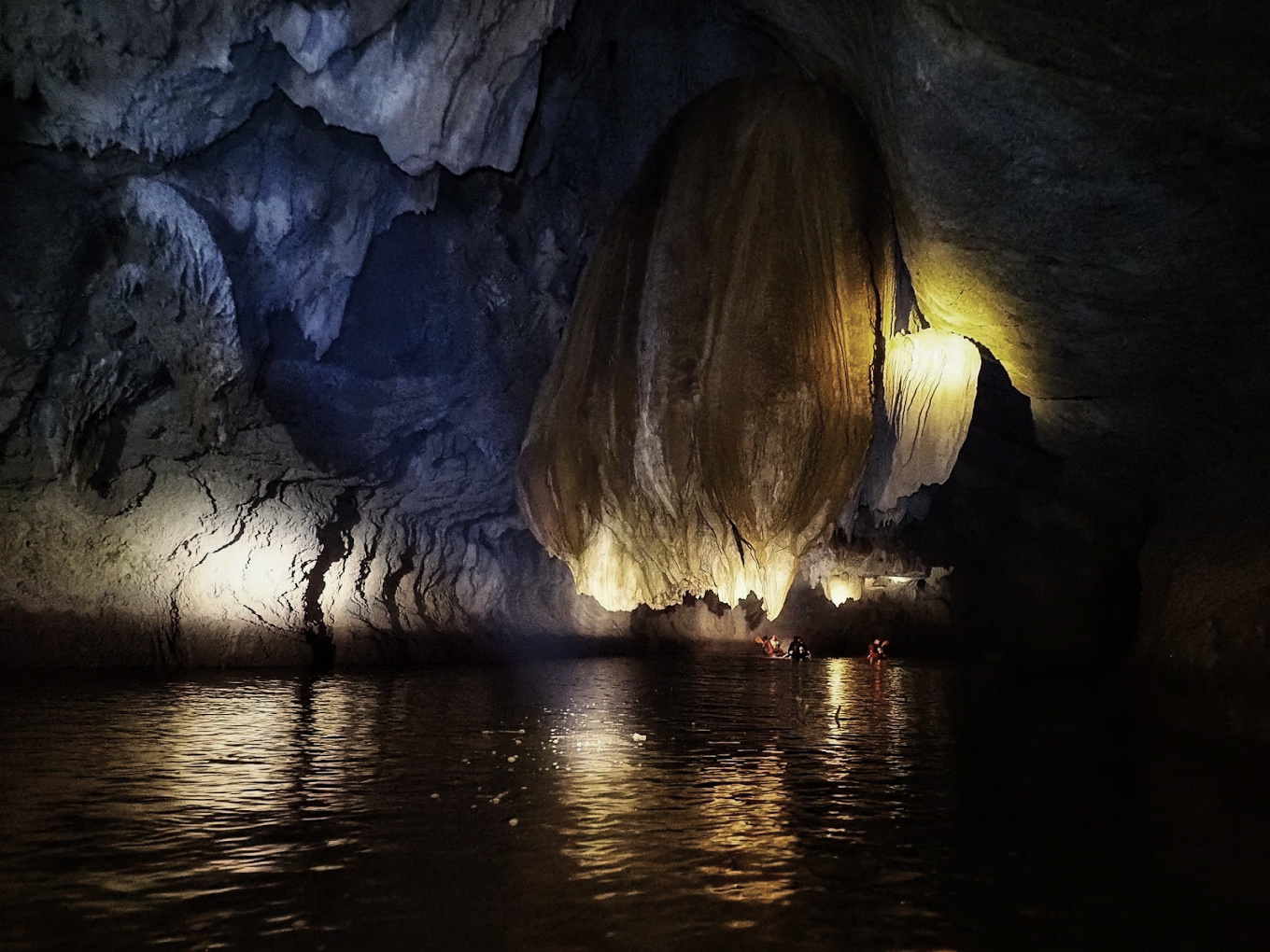 Stegodon Sea Cave interior — limestone tunnels, torchlight, ancient chambers, Thung Wa District