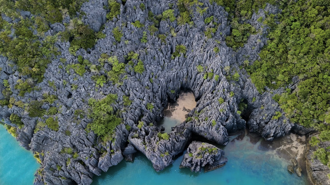 Prasat Hin Panyod hidden lagoon — limestone pinnacles rising from enclosed inland sea